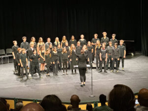 middle school choir on stage