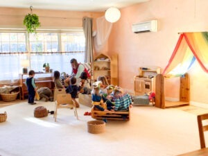 preschool classroom in waldorf style with children playing