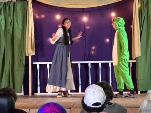 students acting in grade 8 play - princess and the frog