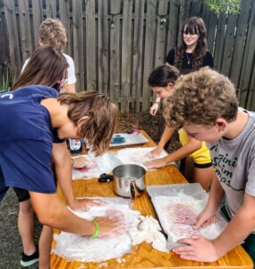 Middle school students working on a wet felted handwork project