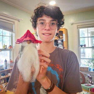 middle school student with his handmade felt gnome