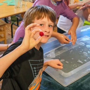 grade school student with a wet felted ball