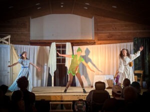 The Darling children learn to fly in the CWS middle school student production of "Peter Pan"