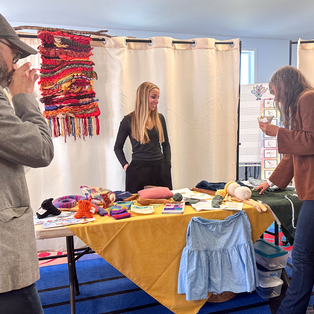 Looking at student work at friends and family day