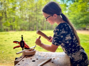Middle school student working on a wood project