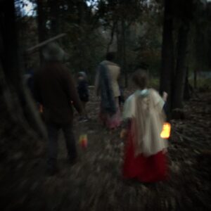 walking with a little lantern through the dark woods