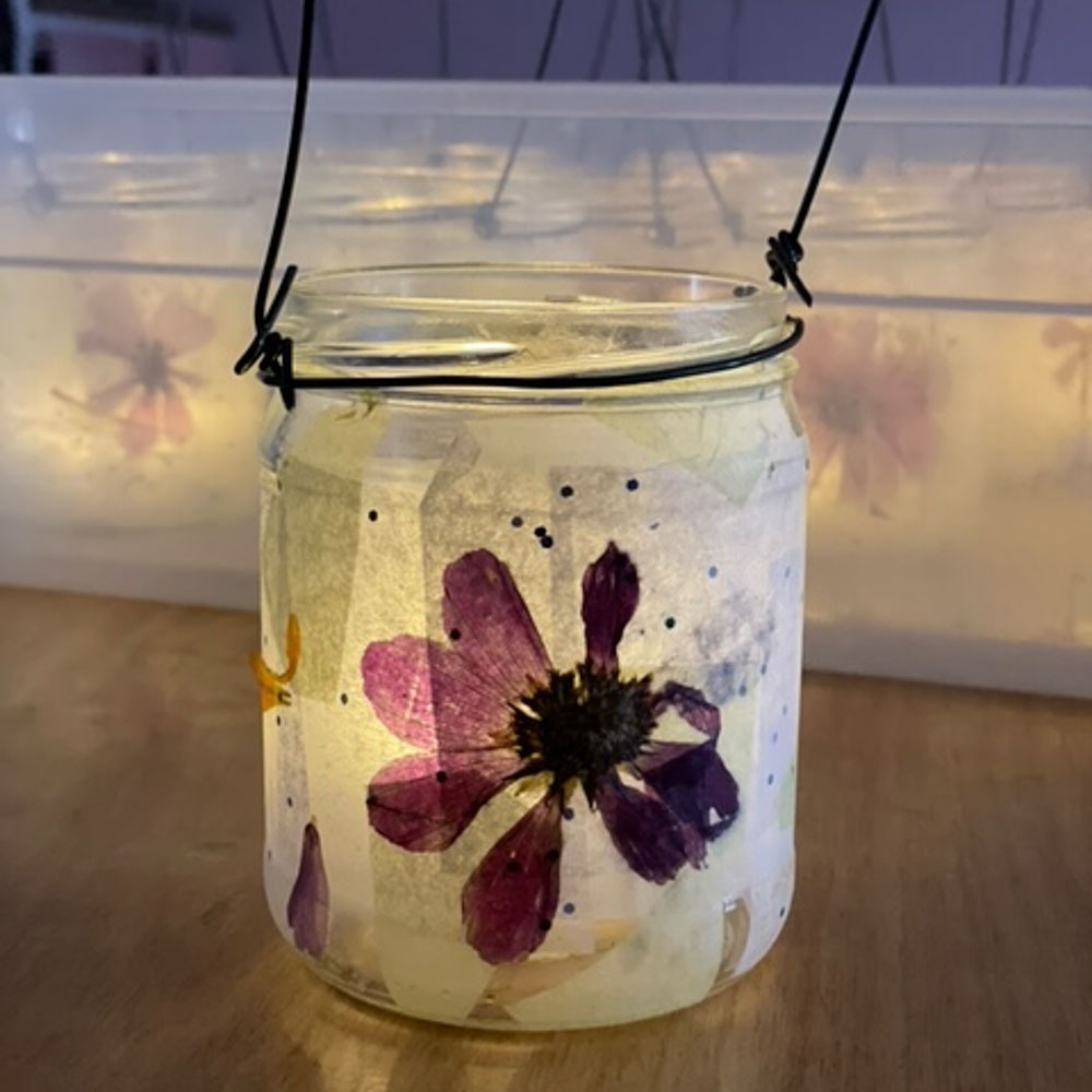 simple jar lantern with a dried flower