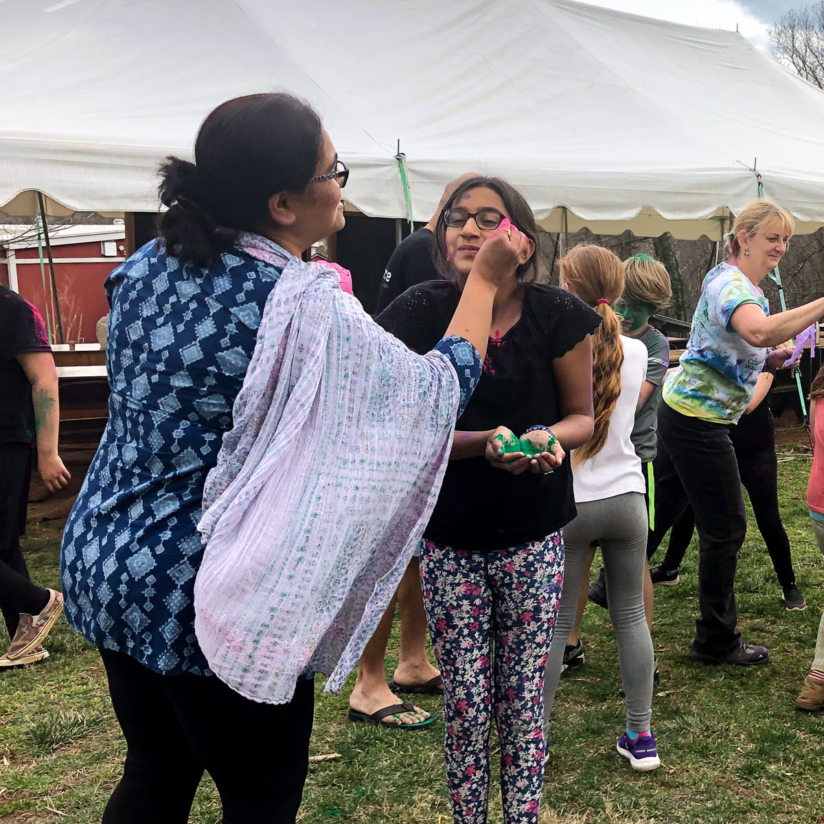 teacher and student celebrating Holi