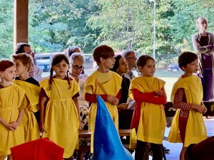 group photo of the Charlottesville Waldorf School (CWS) class of 2026 in second grade performing in the Michaelmas Pageant