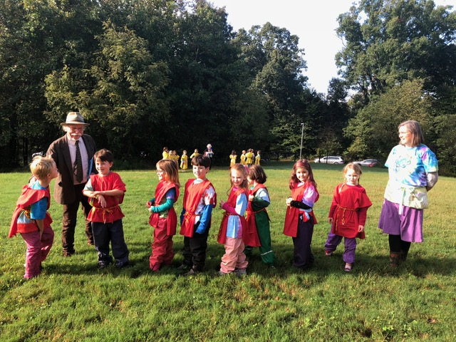 group photo of the Charlottesville Waldorf School (CWS) class of 2026 in first grade performing in the Michaelmas Pageant