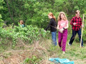 Charlottesville Waldorf School (CWS) students working in the native plants/bee garden