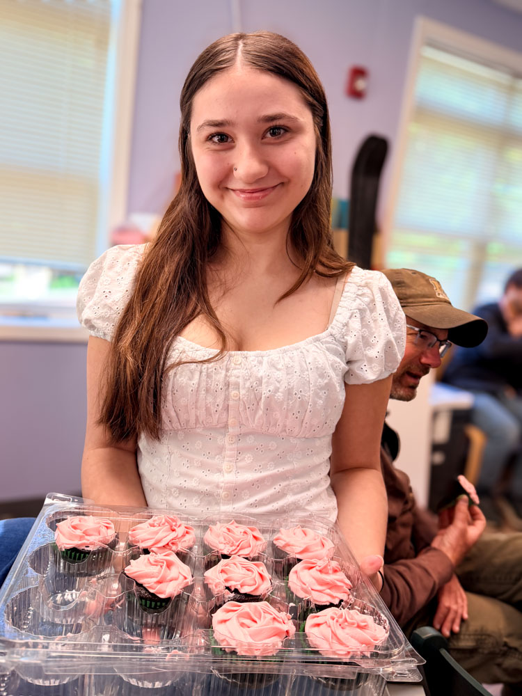 Showing strawberry cupcakes as part of student passion project about baking and the history of the cupcake