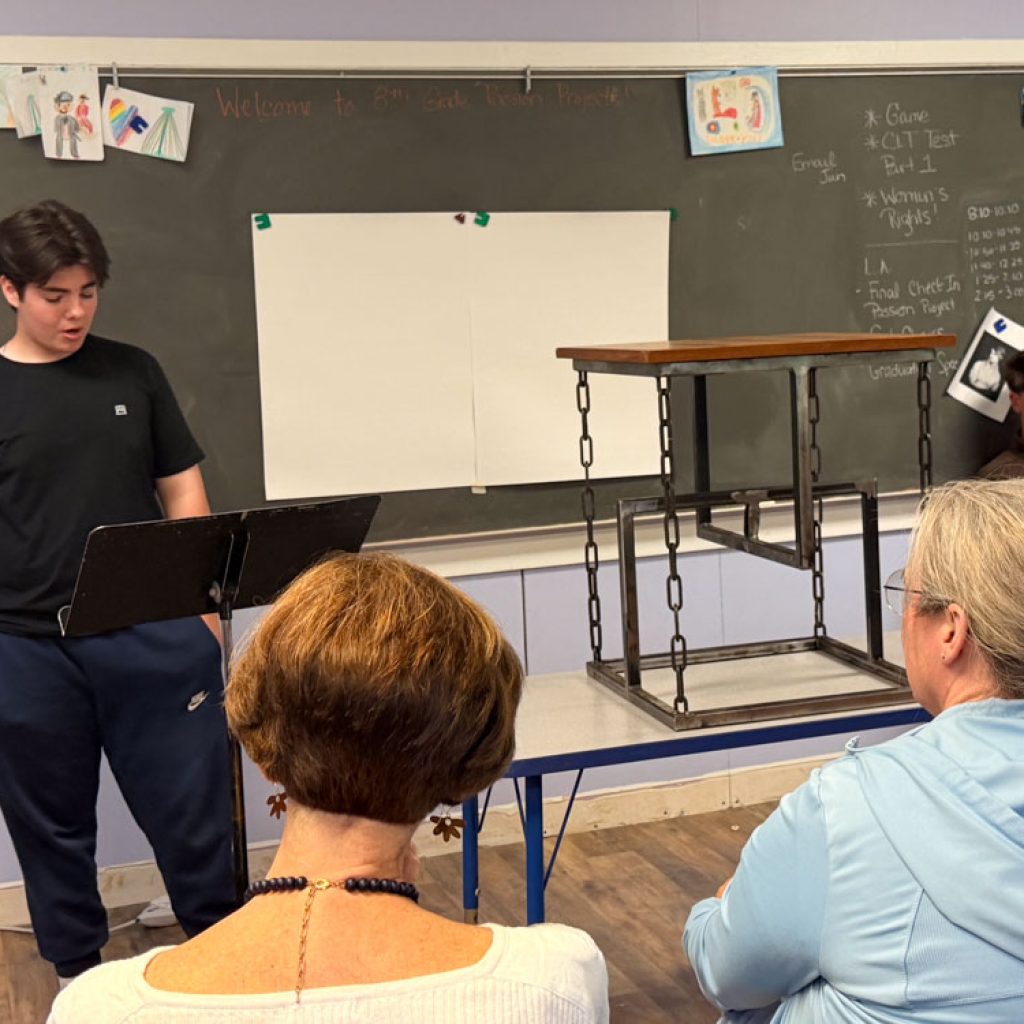 (CWS) Grade 8 student presenting Passion Project about learning to weld and making a gravity table