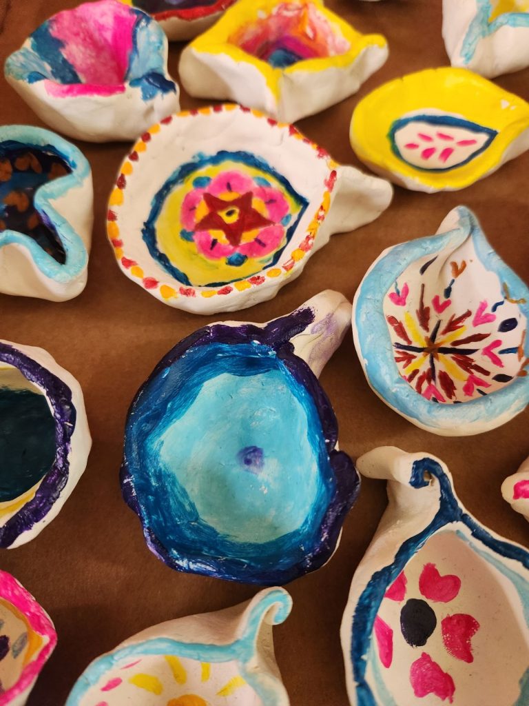beautiful handpainted clay lamps for CWS Diwali celebration